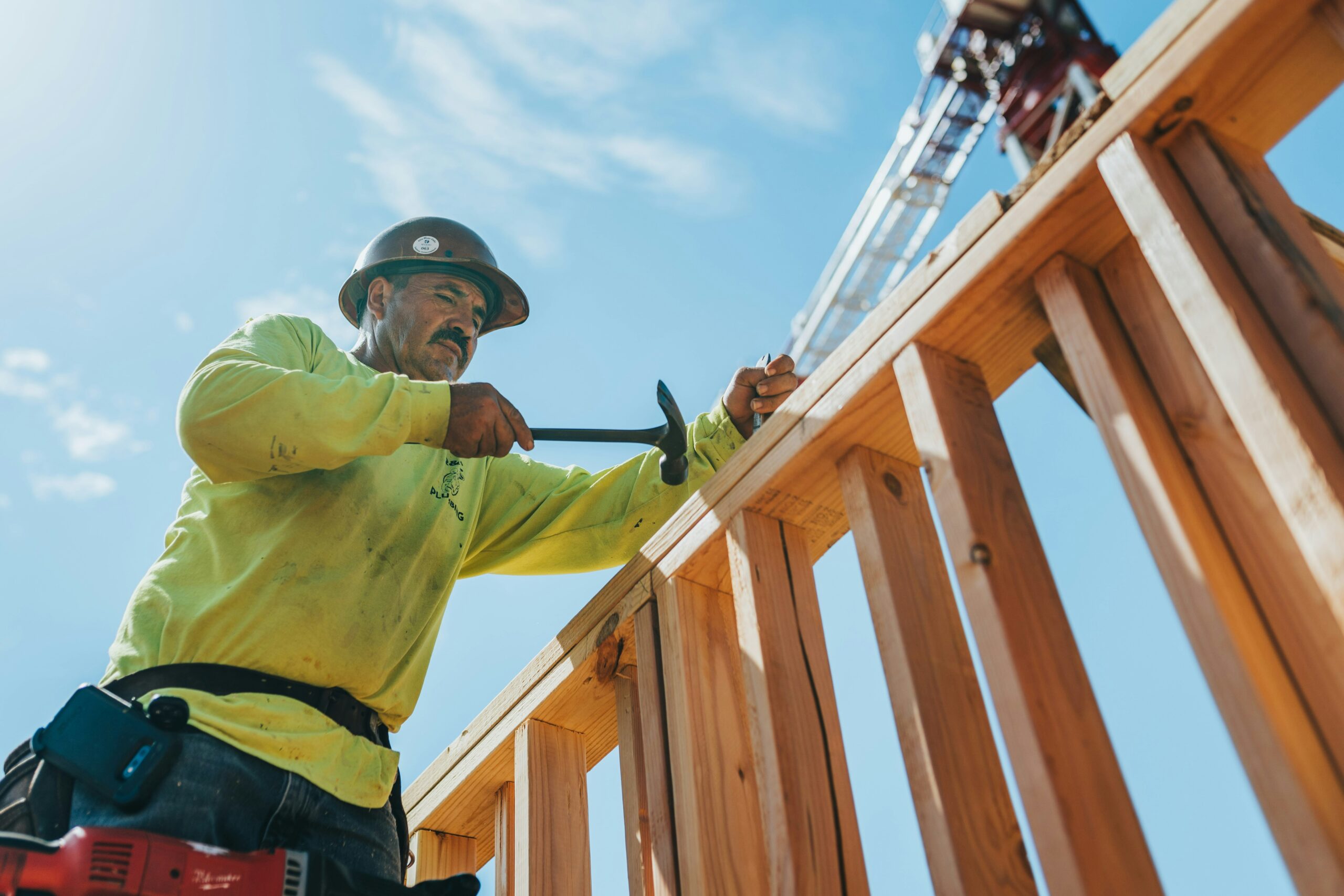 Construction professional working on a framed structure